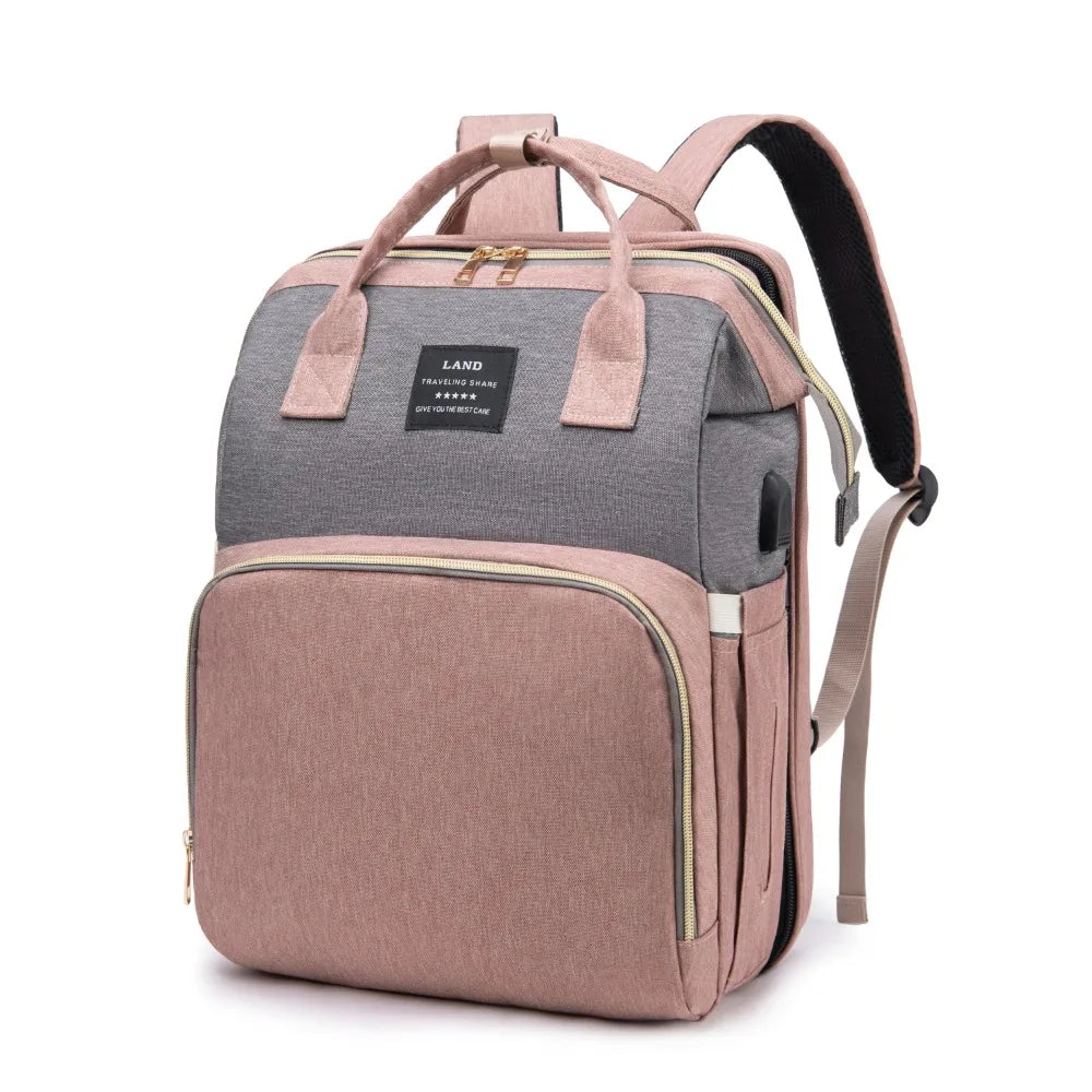 “All-in-one mommy bag 🎒🍼 Foldable crib & big storage for on-the-go moms.”