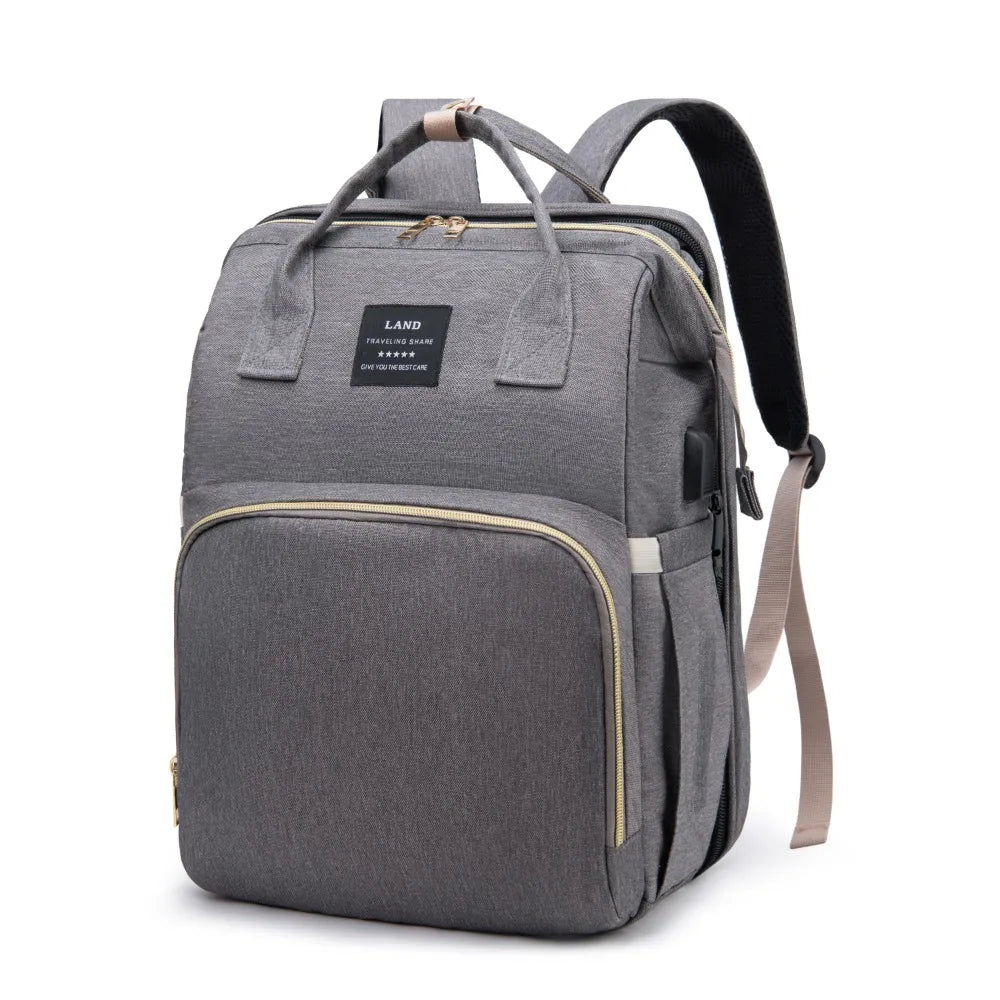 “All-in-one mommy bag 🎒🍼 Foldable crib & big storage for on-the-go moms.”